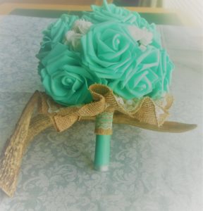 Yes. You read that correctly Bullet Boutonnieres and Bouquets! My daughter and her husband (who were married while still in high school, by the way) chose to incorporate ammunition into their wedding flowers.