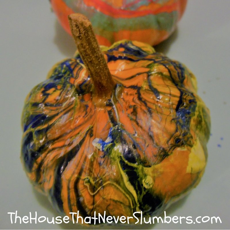 Anyone can make these simple DIY Dipped Pumpkins! This fun fall craft would make a nice addition to your Thanksgiving display or other autumn decorations. Dipping pumpkins takes less time and leaves less mess than traditional pumpkin carving activities, and these DIY Dipped Pumpkins will last longer because you aren't cutting into the pumpkin.