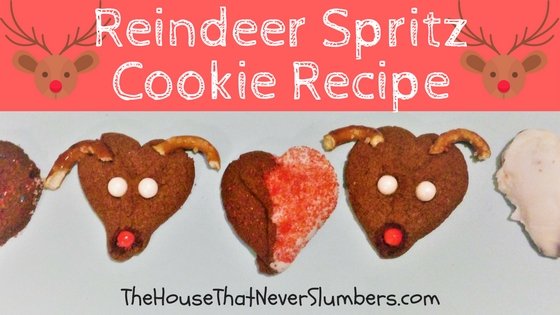 Reindeer Spritz Cookie Recipe - These cute Rudolph cookies will bring a smile to young and old at your next holiday gathering! Reindeer Spritz Cookies are made using a cookie press. Spritz is traditionally a German butter cookie or biscuit formed by squirting the dough through a shaped disc with a cookie press. Kids absolutely love to use a cookie press. 