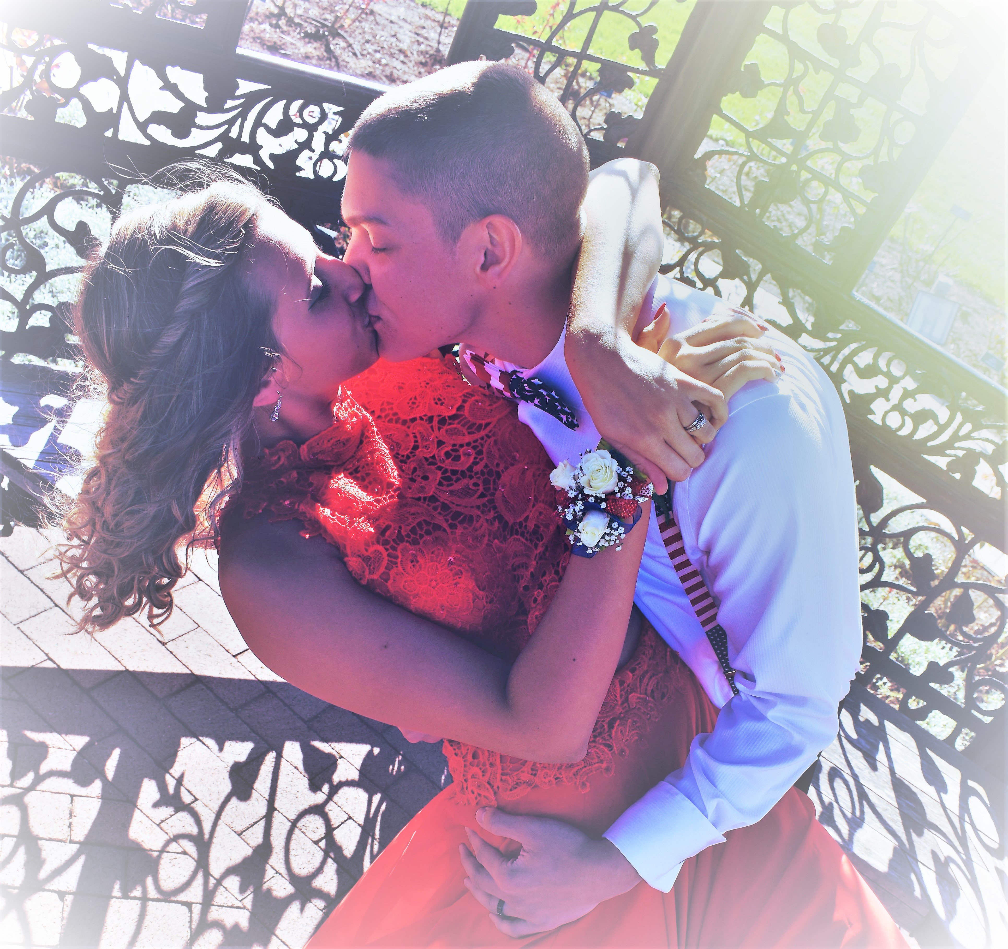 Mr. & Mrs. Merica - Married in High School - Senior Prom - kissing in the gazebo
