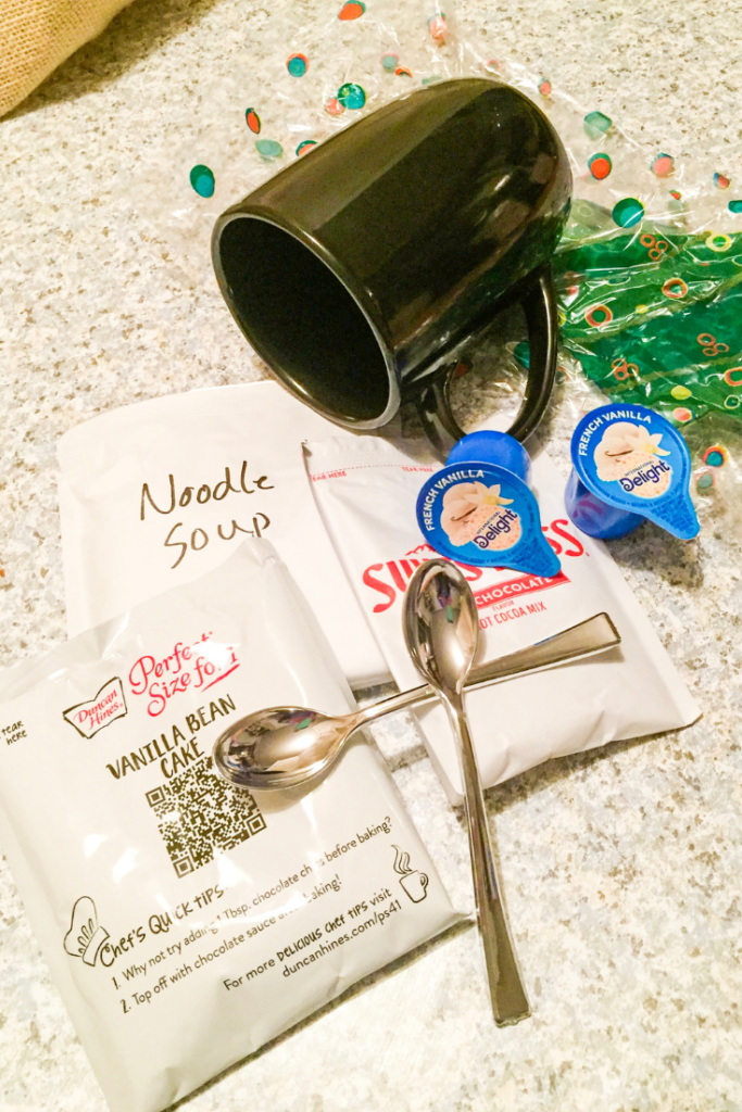 Easy Dollar Store Mug Gift - Make these cozy mug gifts for teachers, coaches, neighbors, and friends! Each one can be put together for under $3. #gifts #easygifts #frugalchristmas #giftsets #muggifts #inexpensivegifts #dollarstore #dollartree #christmas